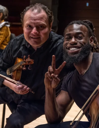 Smiling No Name Pops violinists.